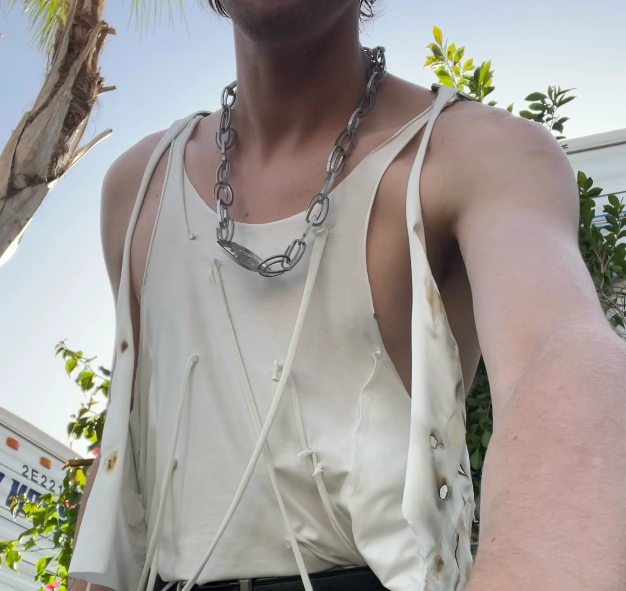 Close view of a white deconstructed stage garment.