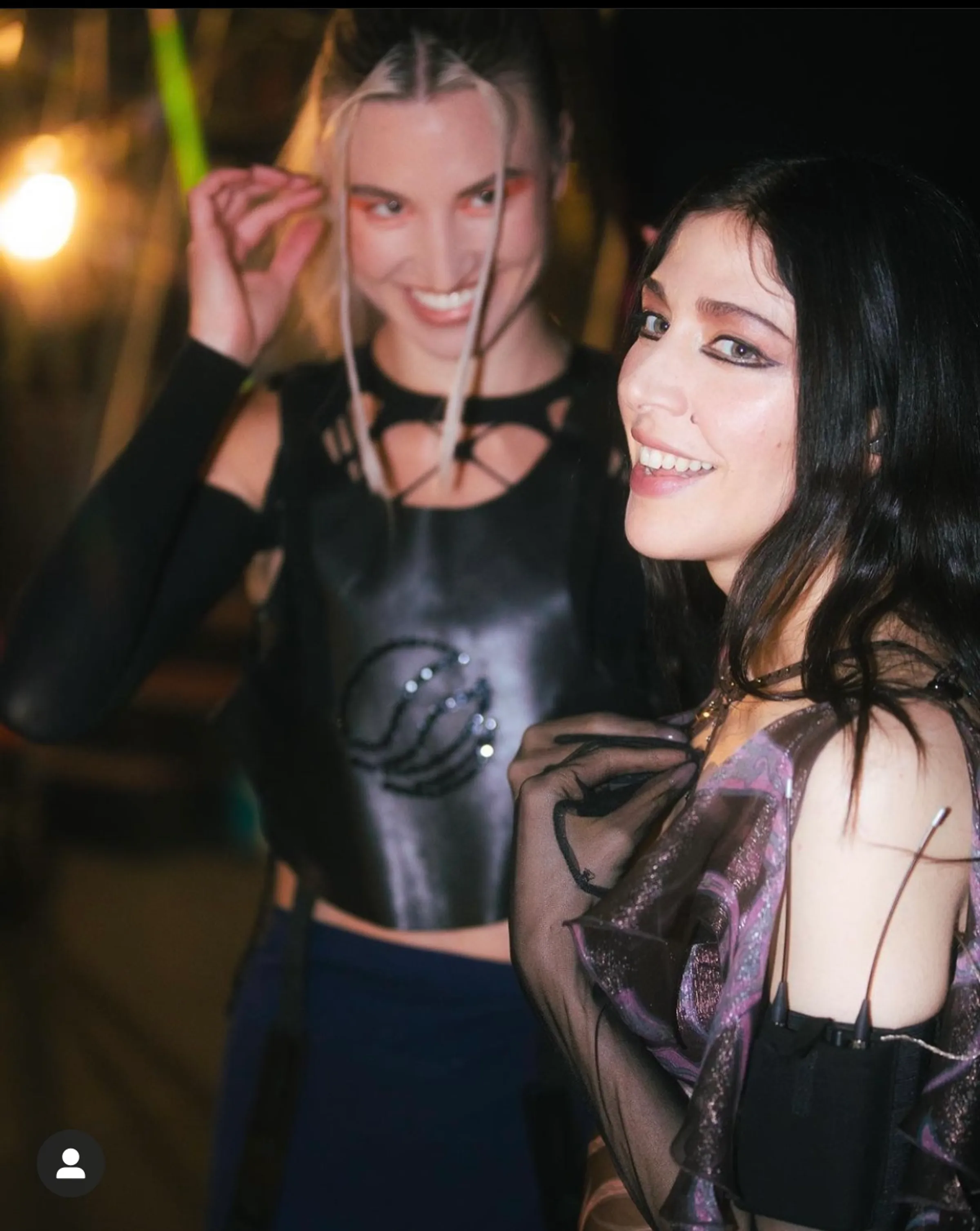 Backstage candid showing the custom black Mersia chest piece.