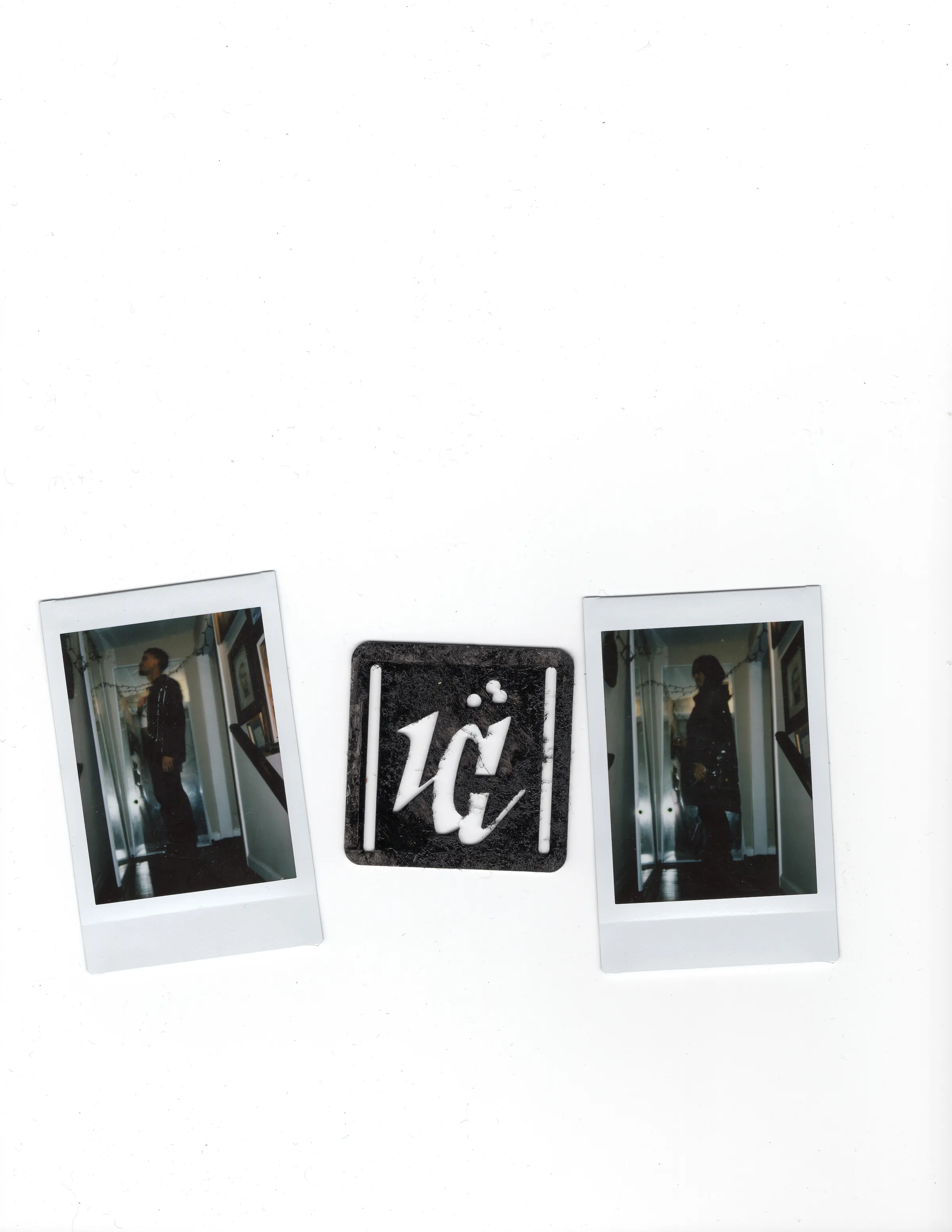 Two Polaroids flanking a weathered black Mersia logo plate.