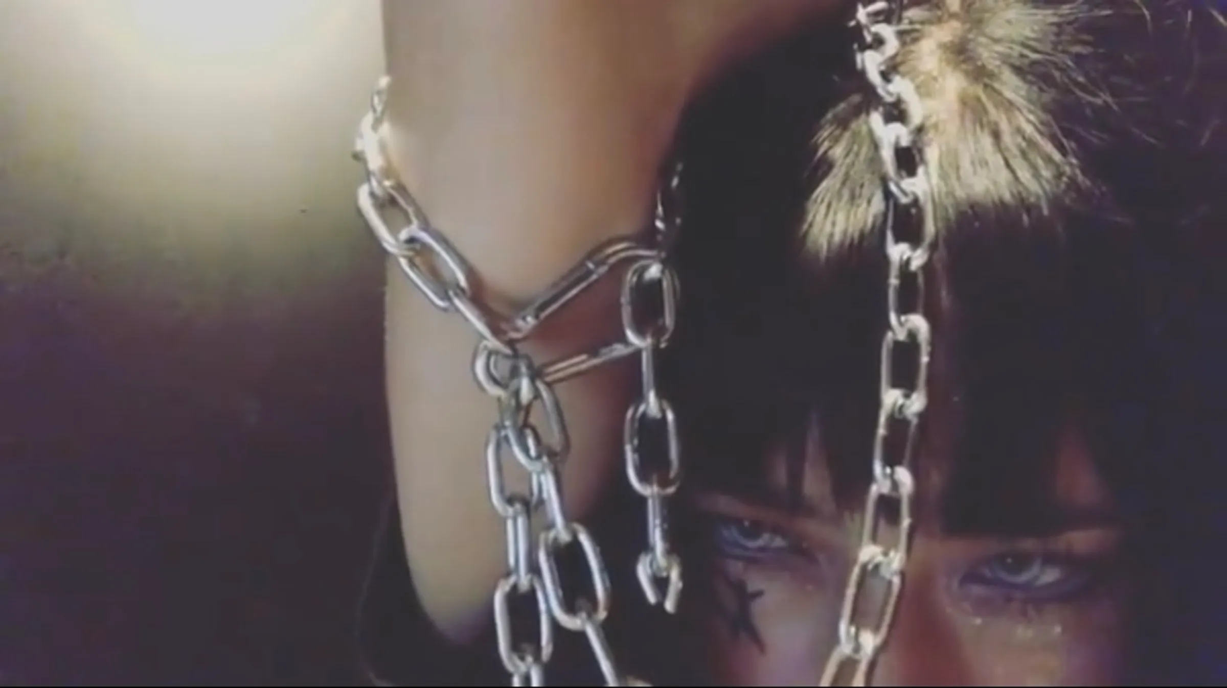 Close detail of Sarah Bonito performing in the custom chain bodysuit.