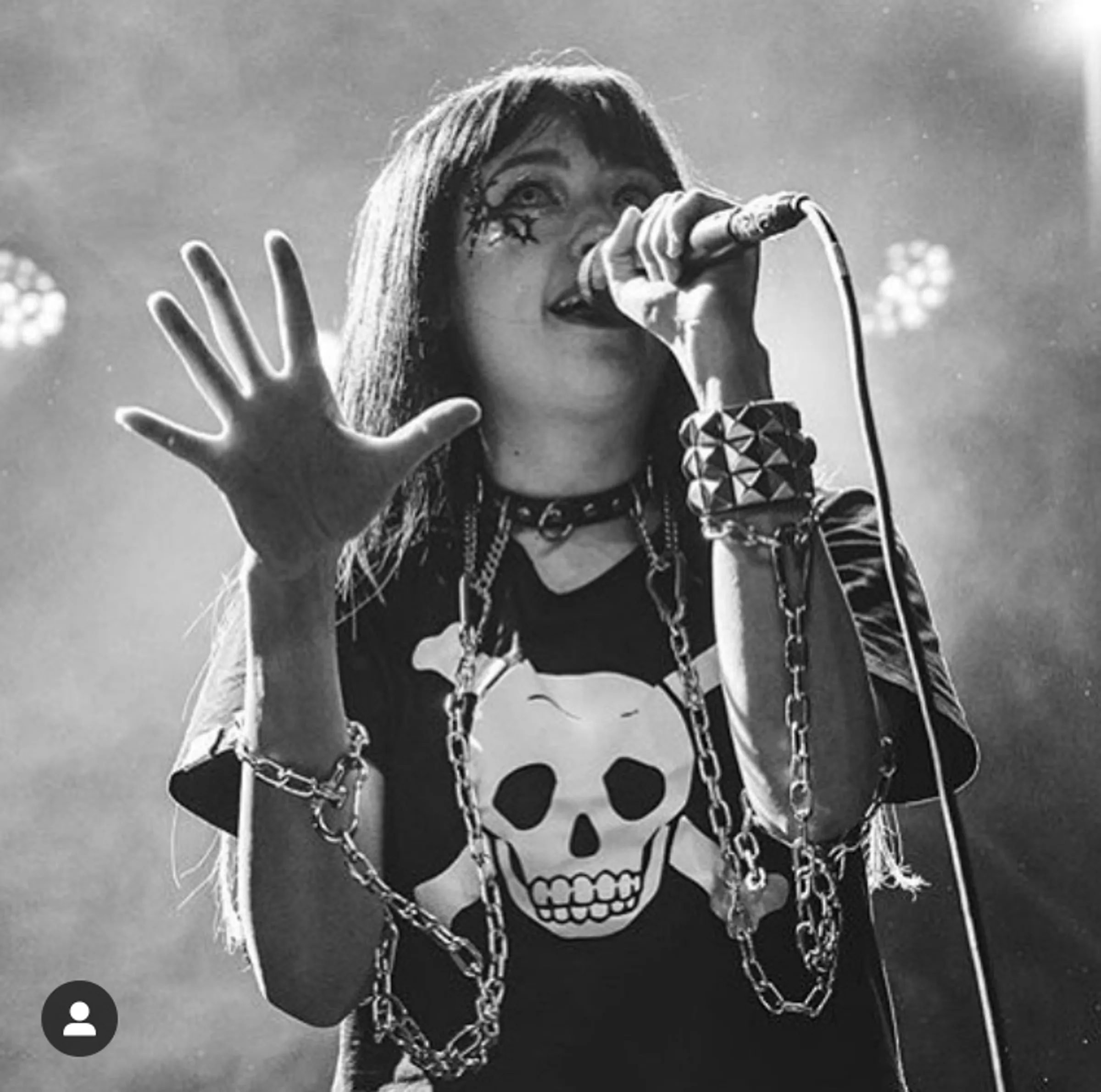 Black-and-white performance portrait of Sarah Bonito wearing the custom chain bodysuit.