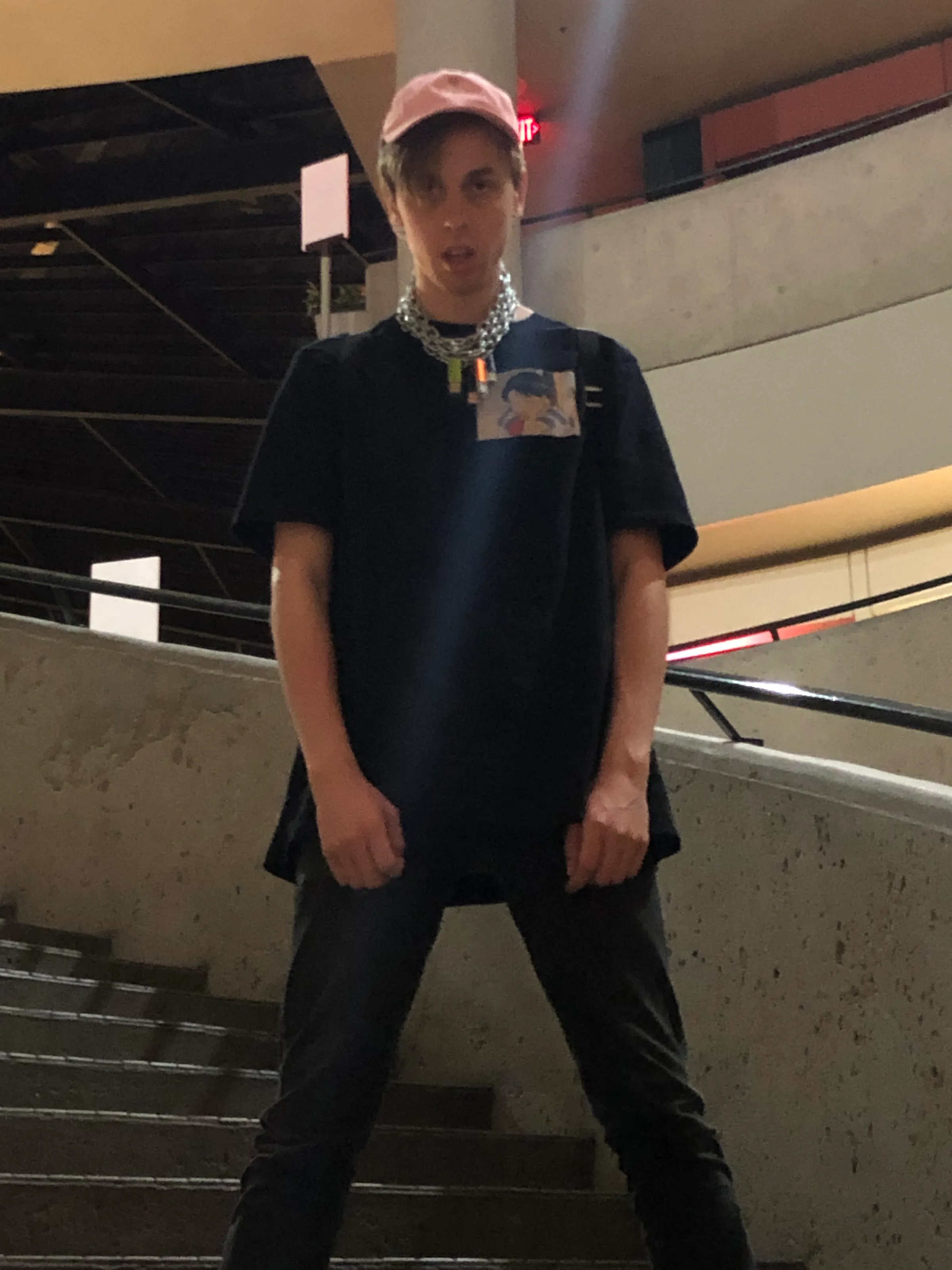 Full-body view of layered USB chains worn with a black shirt.